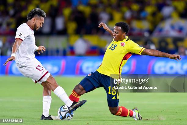 Jhon Arias of Colombia battles for possession with Jose Martinez of Venezuela during a FIFA World Cup 2026 Qualifier match between Colombia and...