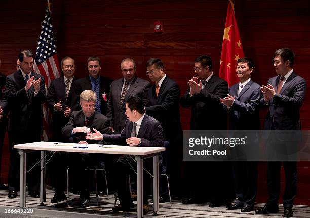 Wisconsin Governor Scott Walker , U.S. Ambassador to China Gary Locke and delegates witness a signing of a Memorandum of Understanding of commercial...