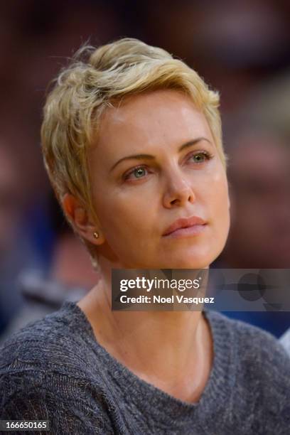 Charlize Theron attends a basketball game between the San Antonio Spurs and the Los Angeles Lakers at Staples Center on April 14, 2013 in Los...