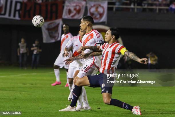 Paolo Guerrero of Peru battles for possession with Gustavo Gomez of Paraguay during a FIFA World Cup 2026 Qualifier match between Paraguay and Peru...