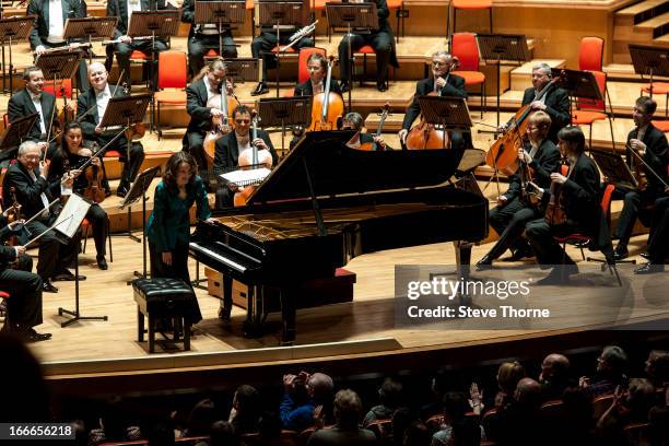 Helene Grimaud performs on stage in concert with the Czech Philharmonic Orchestra at Symphony Hall on April 12, 2013 in Birmingham, England.