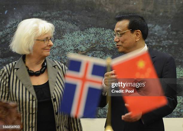 Iceland's Prime Minister Johanna Sigurdardottir and Chinese Premier Li Keqiang attend a signing ceremony at the Great Hall of the People on April 15,...