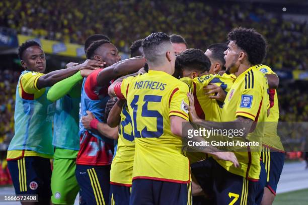 Rafael Santos Borre of Colombia celebrates with teammates after scoring the team's first goal during a FIFA World Cup 2026 Qualifier match between...