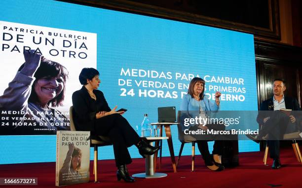 Presidential candidate of Juntos Por El Cambio Patricia Bullrich sits alongside vice-presidential candidate Luis Petri and journalist Silvina...