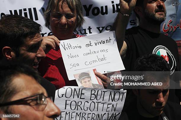 Foreign activists and Palestinians mark the second anniversary of the murder of Italian peace activist Vittorio Arrigoni on April 15, 2013 in Gaza...