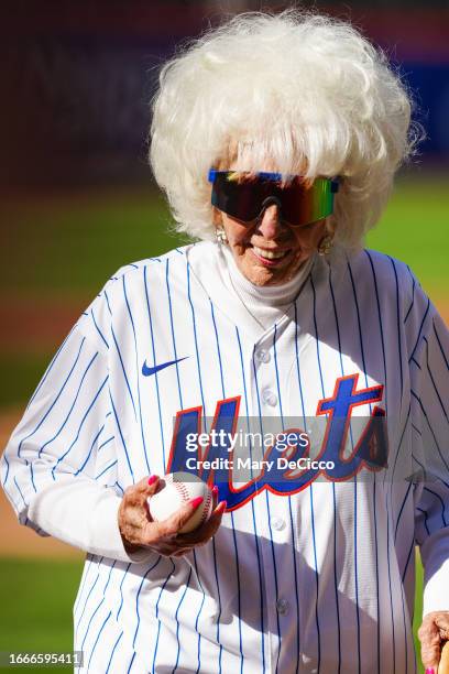 Former All-American Girls Professional Baseball League Peoria Redwings pitcher Maybelle Blair throws out the first pitch prior to the game between...