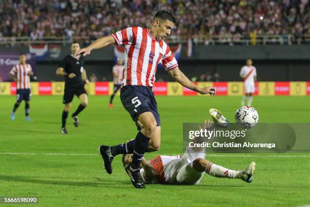 Fabian Balbuena of Paraguay battles for possession with Yoshimar Yotun of Peru during a FIFA World Cup 2026 Qualifier match between Paraguay and Peru...