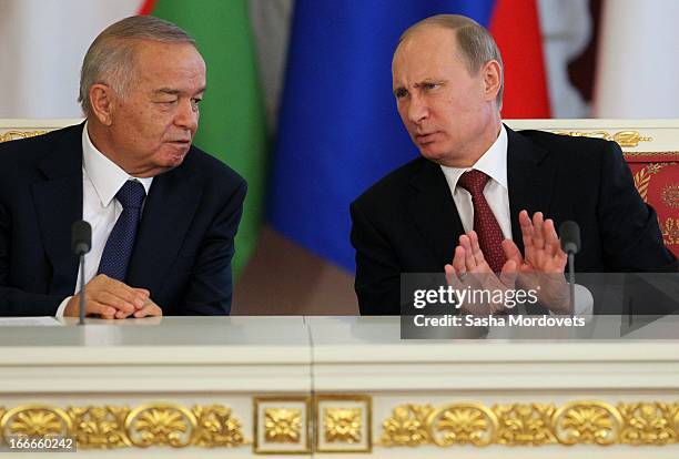 Uzbekistan President Islam Karimov and Russian President Vladimir Putin hold a press conference during their meeting in the Kremlin on April 15, 2013...