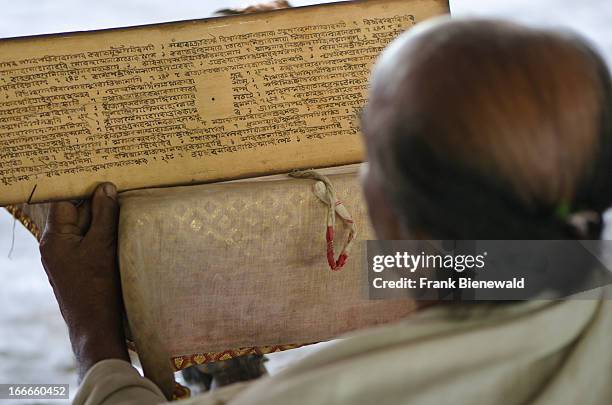 Monks of one of the Sattras, the Vaishnava Monasteries on Majuli Island, reciting from the holy books..