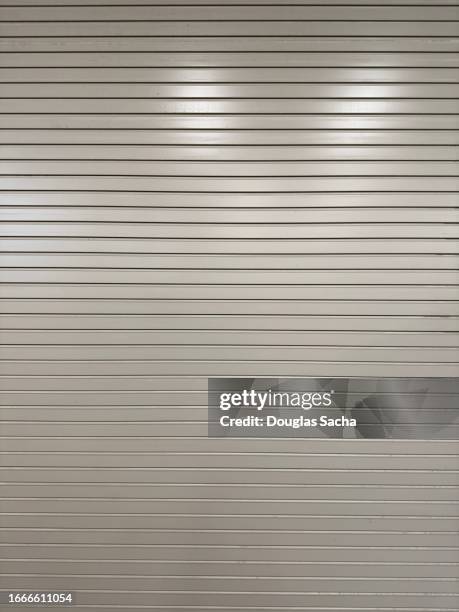 roll up type garage door in a closed position - roll up banner stock pictures, royalty-free photos & images