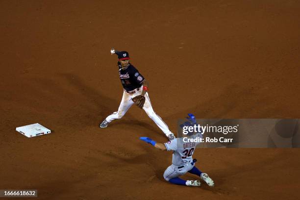 Abrams of the Washington Nationals throws to first base for a double play after forcing out Rafael Ortega of the New York Mets in the ninth inning at...