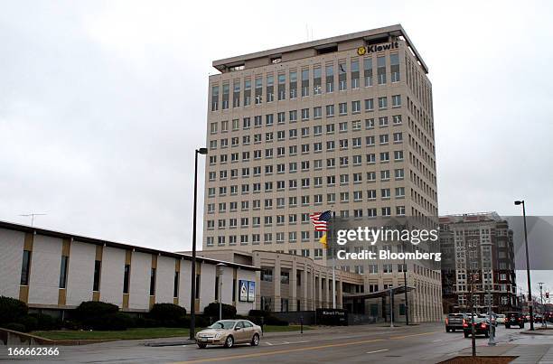 Cars pass in front of Kiewit Plaza, the location of Berkshire Hathaway Inc. Headquarters, in Omaha, Nebraska, U.S., on Thursday, April 11, 2013....