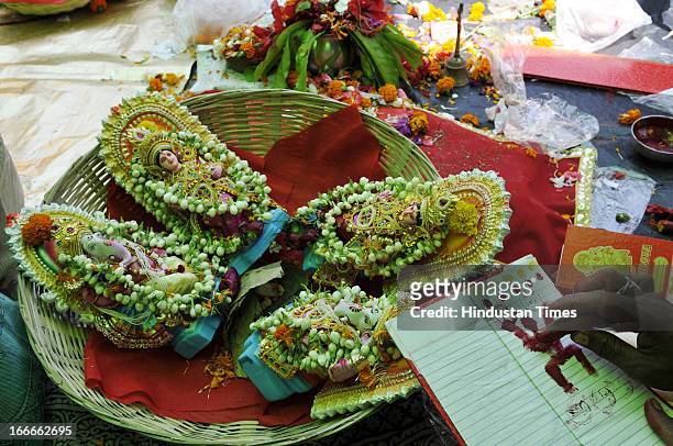 Priest performing rituals to ledger book at Kali Temple during Bengali new year celebration on April 15, 2013 in Kolkata, India. West Bengal...