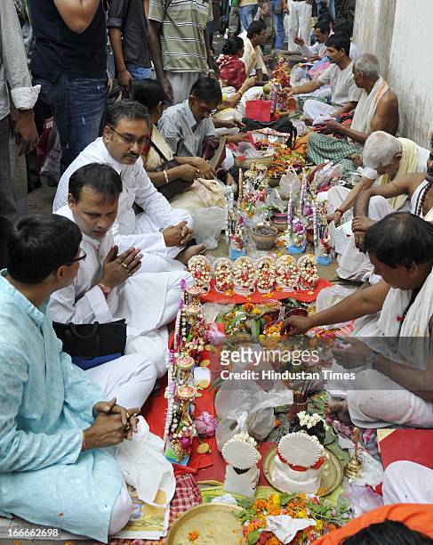 Devotees offering prayer at Kalighat Temple during Bengali new year celebration on April 15, 2013 in Kolkata, India. West Bengal celebrated 'Poila...