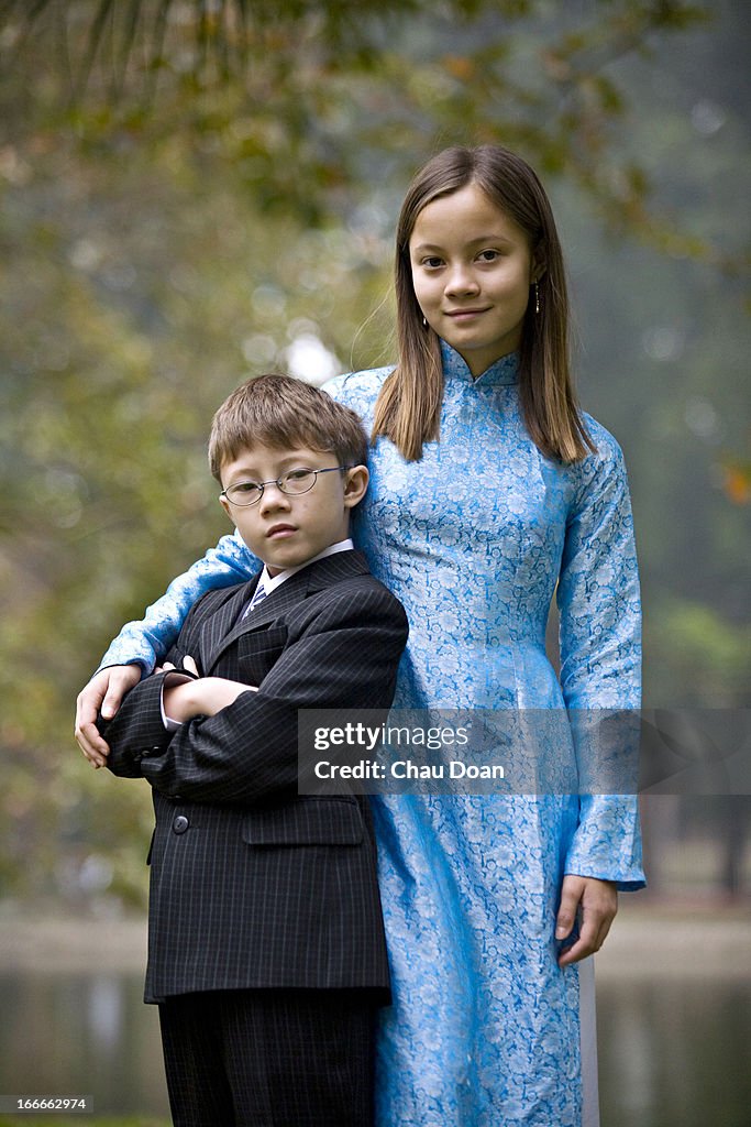 Portrait of young Vietnamese American siblings.   


MODEL...
