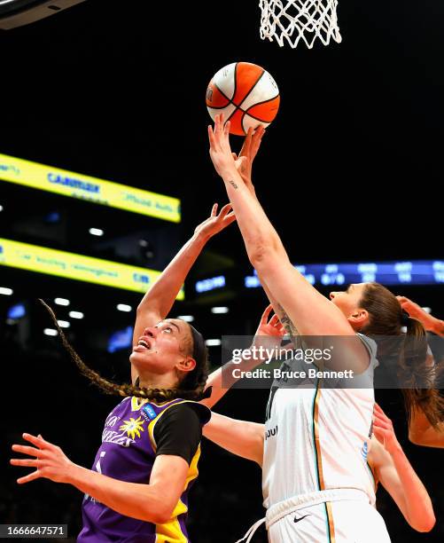 Stefanie Dolson of the New York Liberty defends against Dearica Hamby of the Los Angeles Sparks during the third quarter at the Barclays Center on...