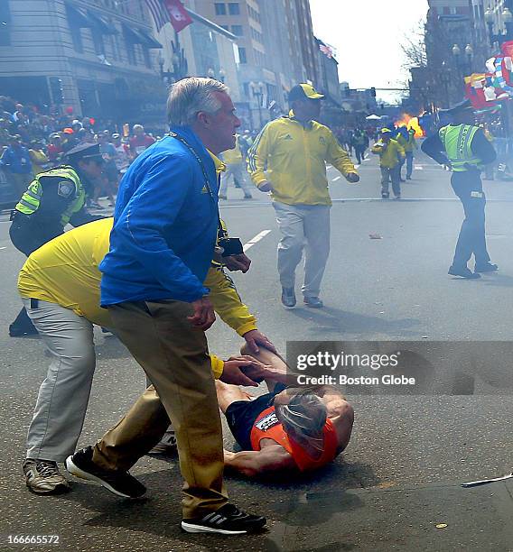 Second explosion goes off as 78-year-old US marathon runner Bill Iffrig was blown to the ground by the first explosion near the finish line of the...