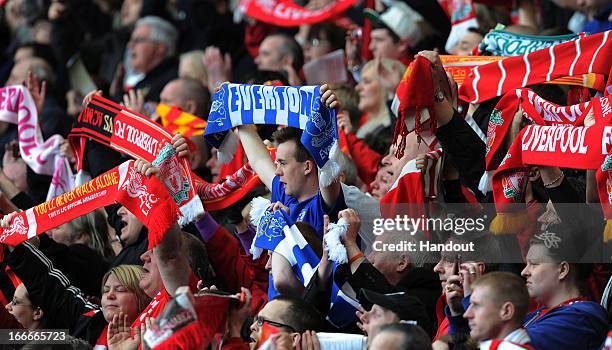 In this handout image provided by Liverpool FC, members of the congregation hold aloft Everton and Liverpool scarves during the 24th Hillsborough...