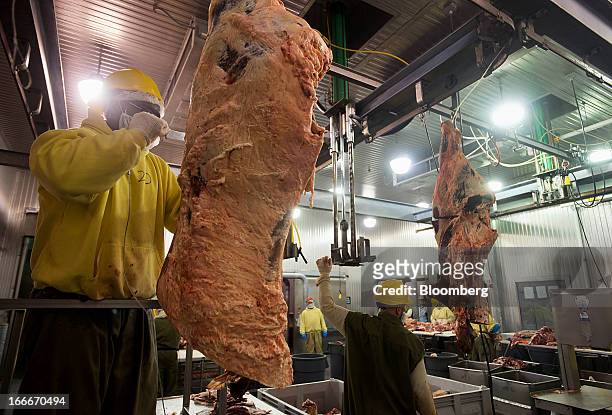 An inmate works with a rack of beef at the Ohio Penal Industries Meat Processing Career Center of the Pickaway Correctional Institution in Orient,...