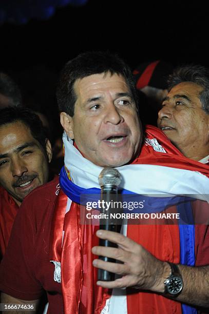 Paraguayan presidential candidate for the Colorado party, Horacio Cartes, speaks during a rally in Limpio, in the outskirts of Asuncion on April 15,...