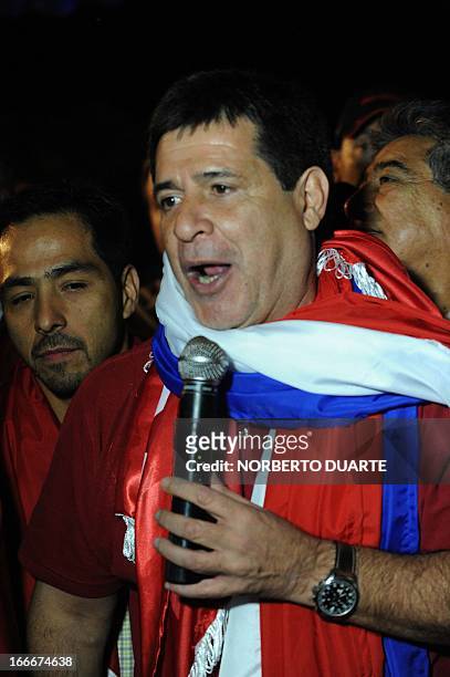 Paraguayan presidential candidate for the Colorado party, Horacio Cartes, speaks during a rally in Limpio, in the outskirts of Asuncion on April 15,...