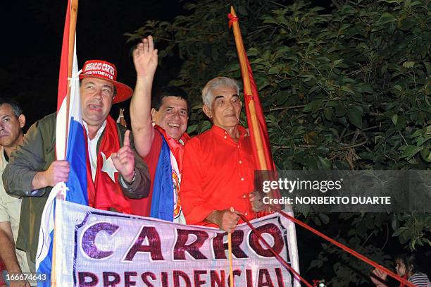 Paraguayan presidential candidate for the Colorado party, Horacio Cartes , waves during a rally in Limpio, in the outskirts of Asuncion on April 15,...