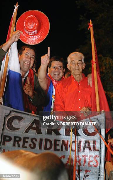 Paraguayan presidential candidate for the Colorado party, Horacio Cartes , waves during a rally in Limpio, in the outskirts of Asuncion on April 15,...