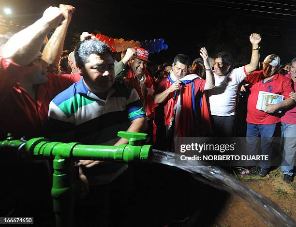 Paraguayan presidential candidate for the Colorado party, Horacio Cartes , speaks during the inauguration of a well in Limpio, in the outskirts of...
