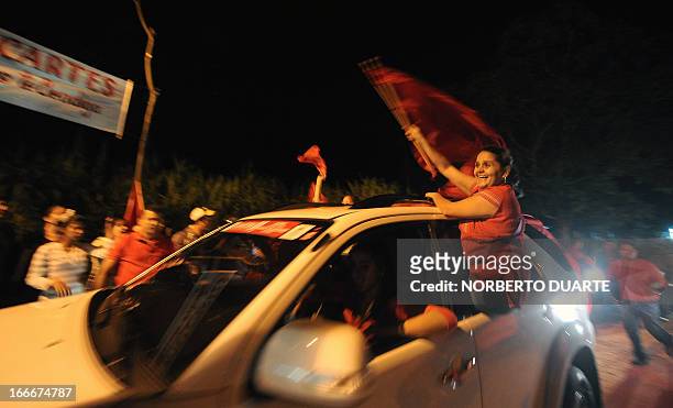 Supporters of Paraguayan presidential candidate for the Colorado party, Horacio Cartes, attend a rally in Limpio, in the outskirts of Asuncion on...