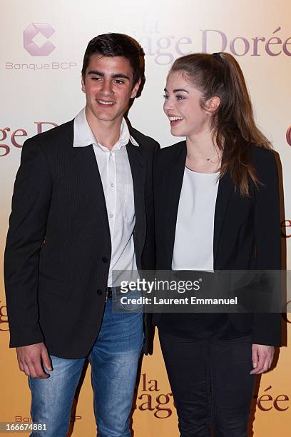 Actors Alex Alves Pereira and Alice Isaaz poses during the premiere of the movie "La Cage Doree" at Cinema Gaumont Marignan on April 15, 2013 in...