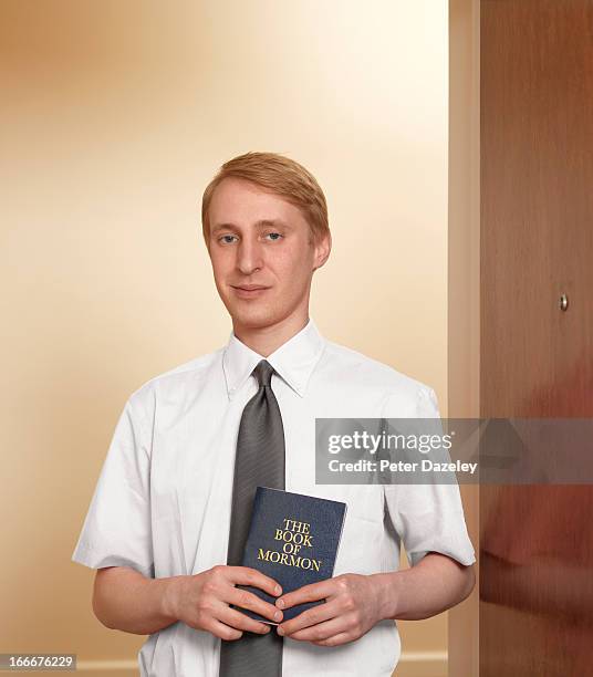 jehovah's witness with book of mormon - mormon stock pictures, royalty-free photos & images