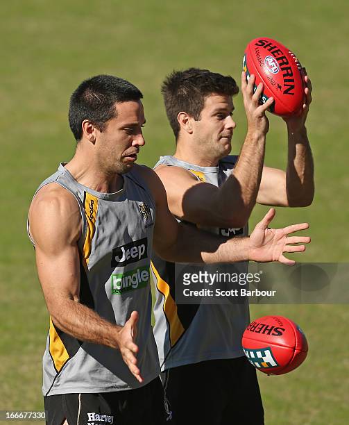 Troy Chaplin and Trent Cotchin of the Tigers compete for the ball during a Richmond Tigers AFL training session at ME Bank Centre on April 16, 2013...