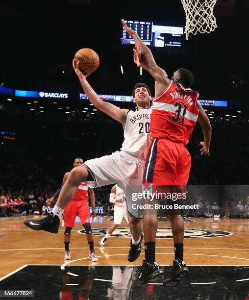 Tornike Shengelia of the Brooklyn Nets goes up and scores two against the Washington Wizards at the Barclays Center on April 15, 2013 in New York...