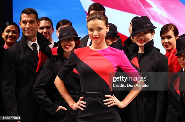 Miranda Kerr showcases the Qantas uniform alongside Qantas staff during the Qantas uniform unveiling at Hordern Pavilion on April 16, 2013 in Sydney,...