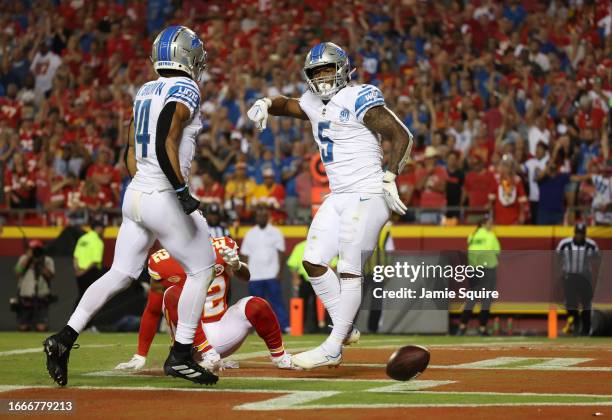 David Montgomery of the Detroit Lions celebrates his touchdown in the fourth quarter against the Kansas City Chiefs at GEHA Field at Arrowhead...