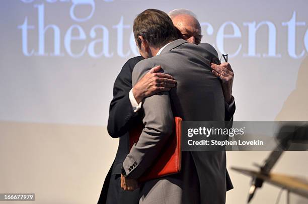 Kevin Spacey and Christopher Plummer embrace onstage at the 13th annual Monte Cristo Awards at The Edison Ballroom on April 15, 2013 in New York City.