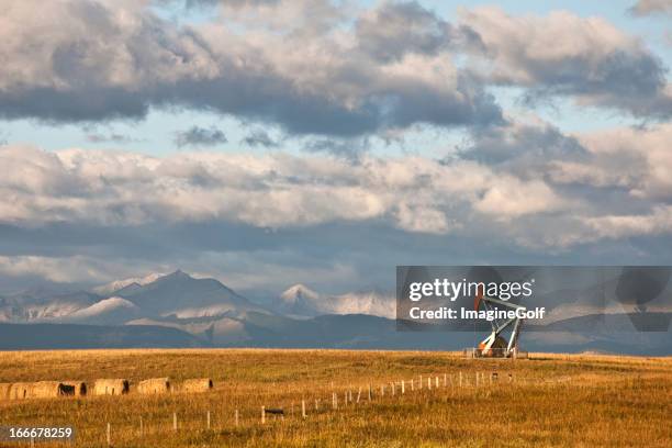 oil rig in alberta in fall - oil rig alberta stock pictures, royalty-free photos & images