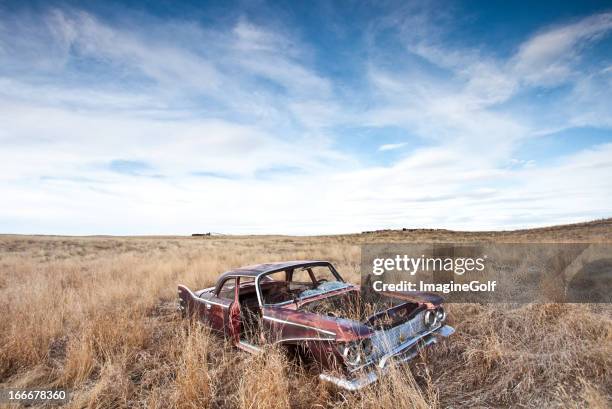 old abandoned car on the plains - ghost town stock pictures, royalty-free photos & images
