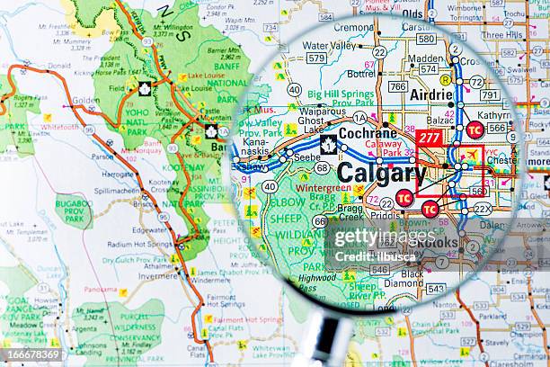 cities under magnifying glass on map: calgary - calgary alberta 個照片及圖片檔