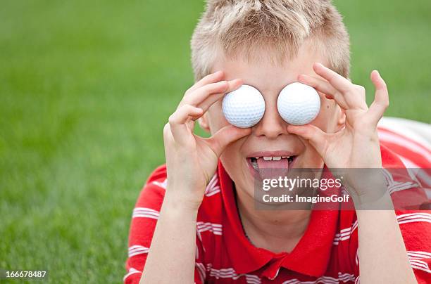junior golfer with golf balls for eyes - junior level stock pictures, royalty-free photos & images