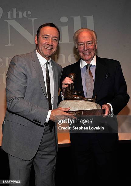 Kevin Spacey and Christopher Plummer pose with award onstage at the 13th annual Monte Cristo Awards at The Edison Ballroom on April 15, 2013 in New...