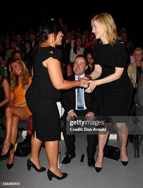 Alan Joyce looks on as Kate Ceberano greets Cate Blanchett during the Qantas uniform unveiling at Hordern Pavilion on April 16, 2013 in Sydney,...