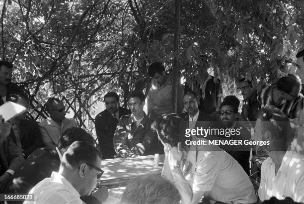 Conference Of Colonel Houari Boumedienne In Oran. Oran- 21 juillet 1962- Lors de sa conférence, le colonel Houari BOUMEDIENNE assis à une table sous...