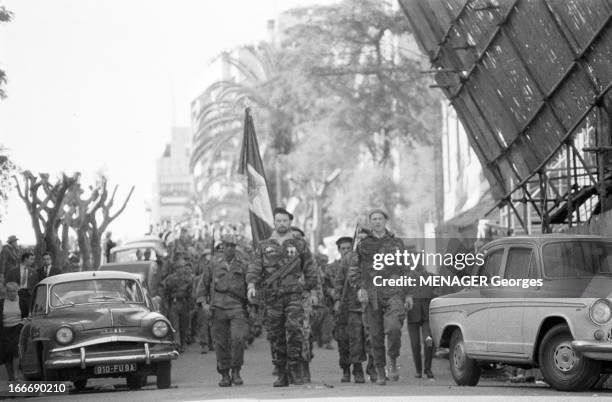 The Barricades. Alger- 2 février 1960- Les émeutes d'Alger: reddition du camp retranché des insurgés, Pierre Lagaillarde suivi du capitaine Guy Forzi...