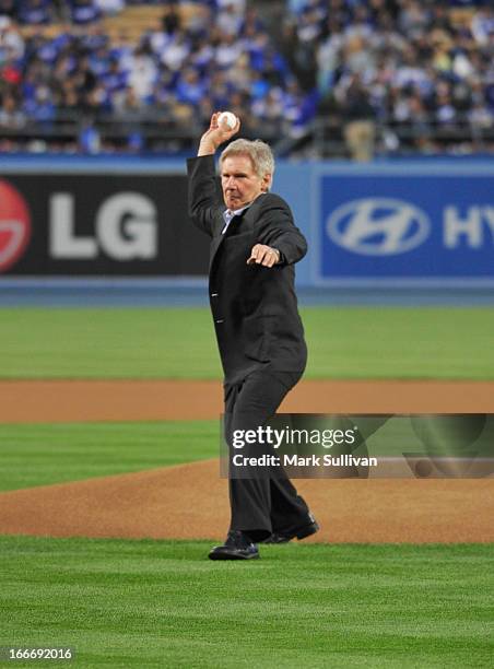 Actor Harrison Ford throws out the ceremonial first pitch on Jackie Robinson Day at Dodger Stadium on April 15, 2013 in Los Angeles, California.