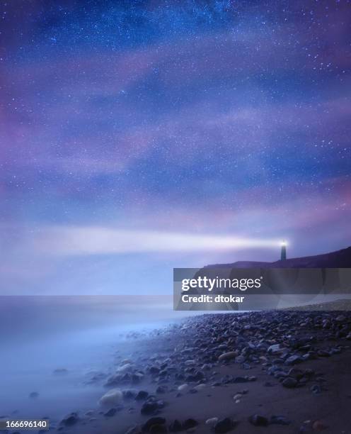 lighthouse with stars at night - rocky star stock pictures, royalty-free photos & images