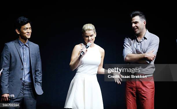 Actor John Cho speaks with actors Alice Eve and Zachary Quinto at a Paramount Pictures presentation to promote their upcoming film, "Star Trek Into...