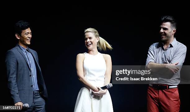 Actor John Cho speaks with actors Alice Eve and Zachary Quinto at a Paramount Pictures presentation to promote their upcoming film, "Star Trek Into...