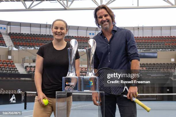 Ash Barty and Patrick Rafter for photos next to the Brisbane International trophies during a Tennis Australia media opportunity at Queensland Tennis...