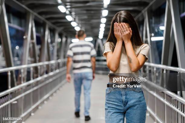 sad upset woman crying after a painful break-up - menselijke relaties stockfoto's en -beelden